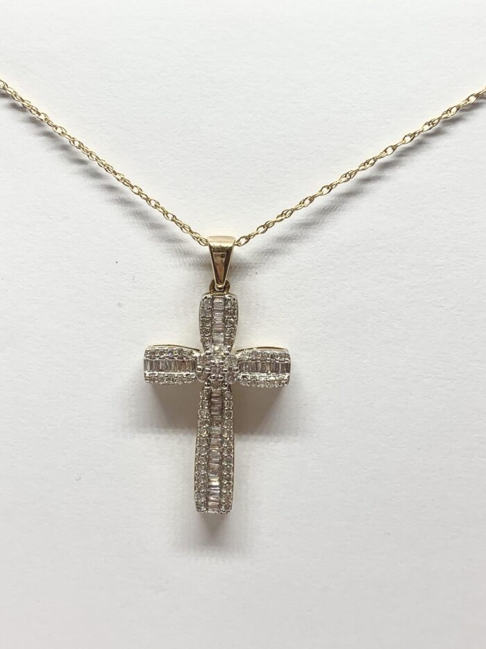 Diamond-encrusted cross pendant on a gold chain.