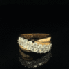 Yellow gold bypass ring with diamond cluster.