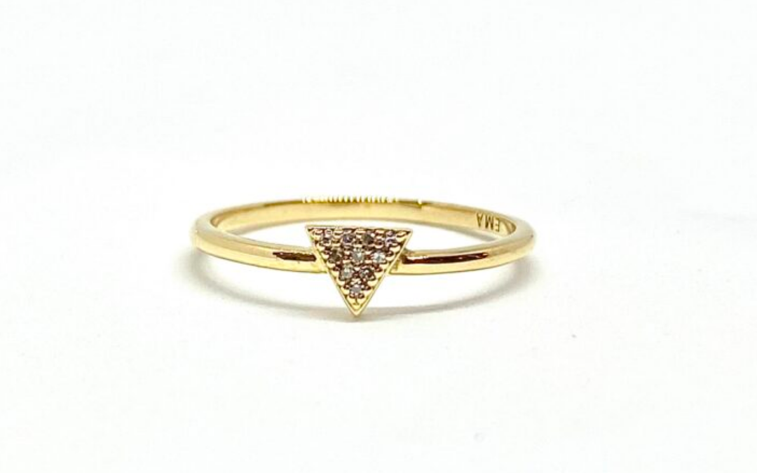 Gold triangle ring with diamond accent stones.