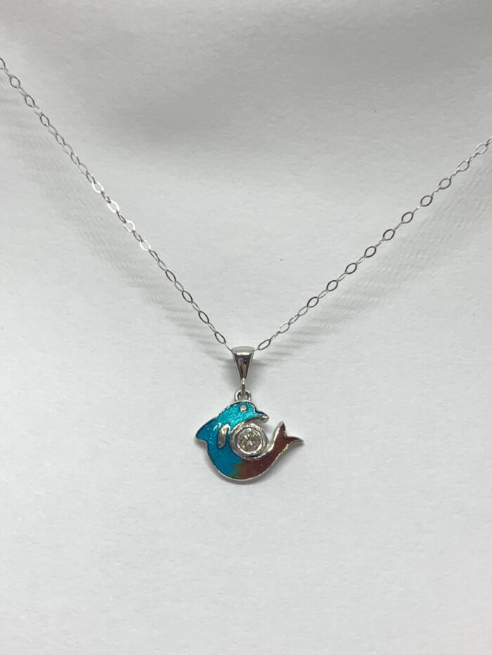 Gold necklace with blue and white dolphin pendant