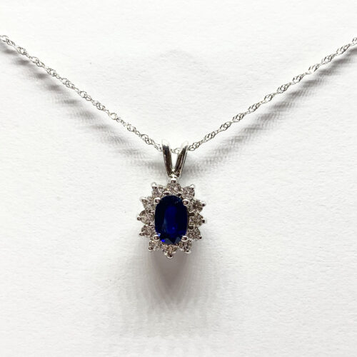 Oval sapphire pendant with diamonds