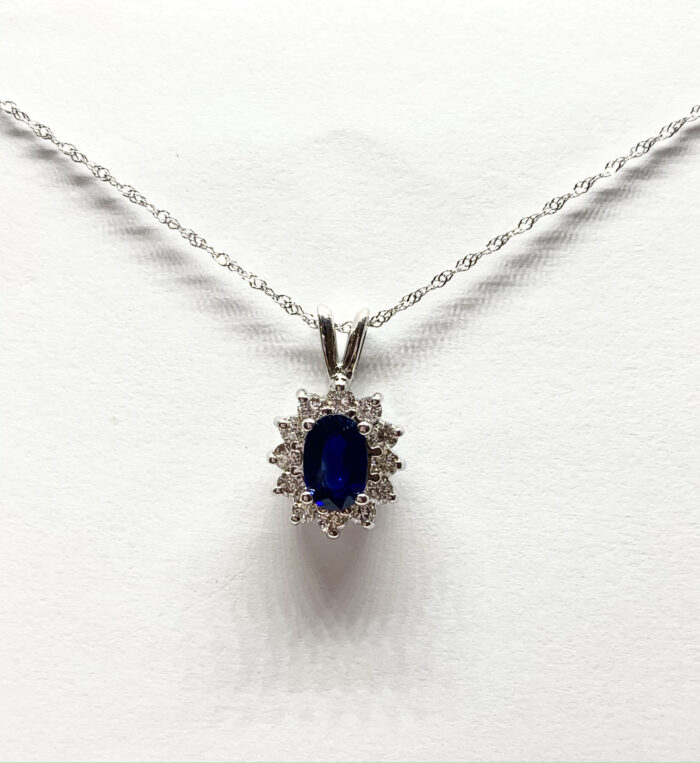 Oval sapphire pendant with diamonds