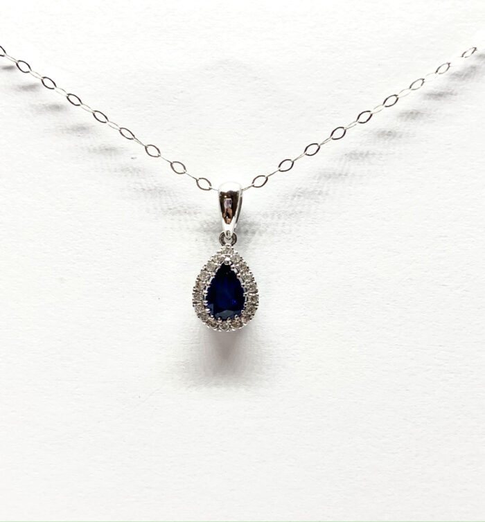 Dazzling sapphire pendant shimmers with diamonds