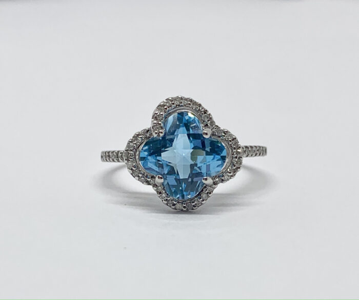 Blue topaz ring with diamond accents in white gold