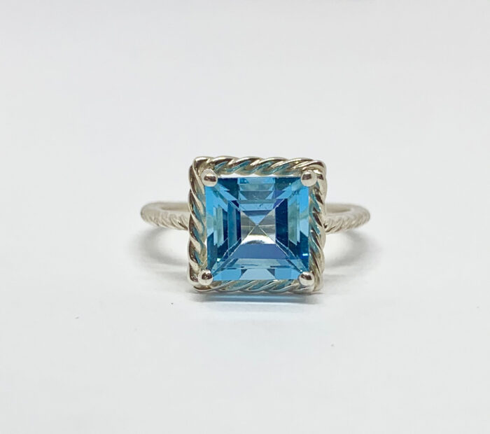Sterling silver ring with square blue topaz