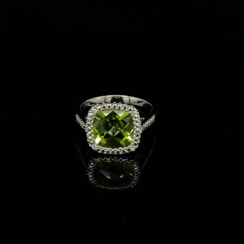 Emerald green gemstone ring with sparkling diamonds