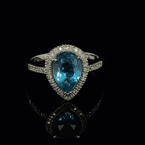 Pear-shaped blue topaz ring with diamonds