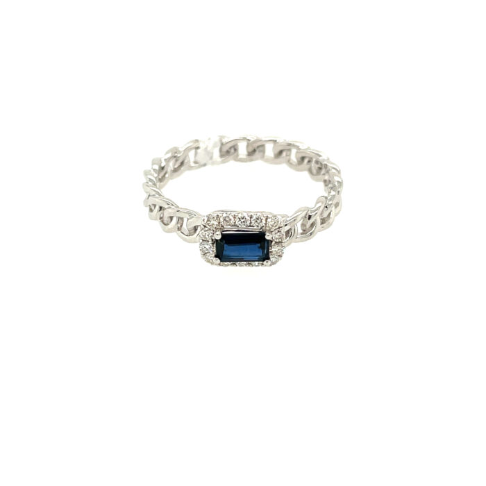 Sapphire shines amidst sparkling diamonds in white gold ring