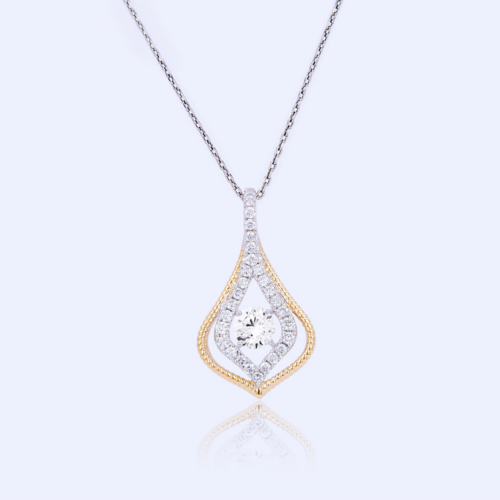 Two-toned necklace sparkles with a diamond pendant