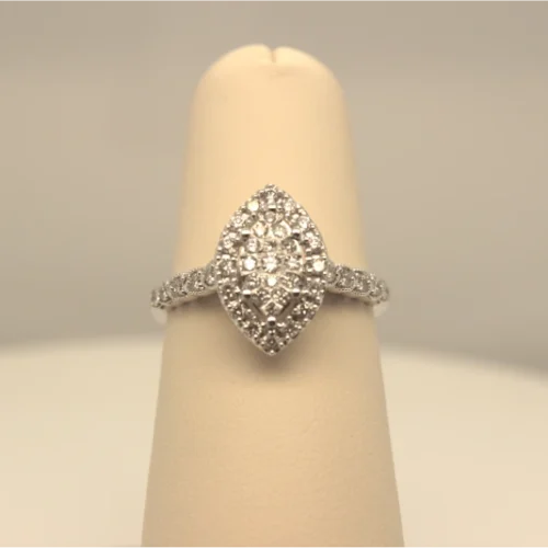 A photo featuring a pear-shaped diamond engagement ring