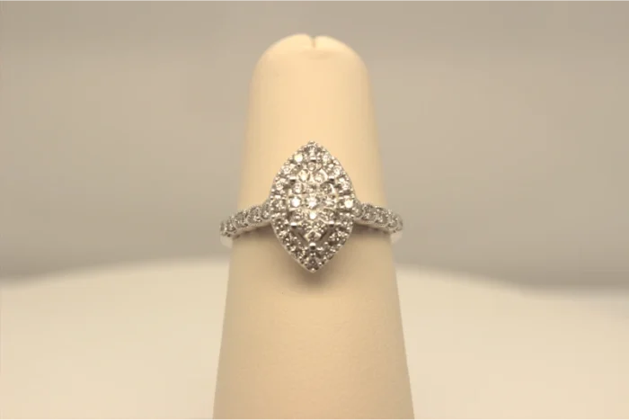 A photo featuring a pear-shaped diamond engagement ring